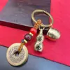 Llavero de Latón Cilindro de Cien Bendiciones Atrae Riqueza Monedas de los Cinco Emperadores Calabaza de Cobre Llavero Vintage Atrae Fortuna Colgante Unisex