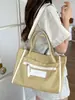 Bolso tote de lona de gran capacidad para mujer, nicho transfronterizo, nuevo bolso de mano y bandolera casual ligero para el verano de 2026