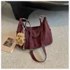 Bolsa grande de couro macio vintage para o dia a dia, de alta qualidade, para mulheres, nova moda 2026, versão coreana, bolsa simples de ombro e transversal
