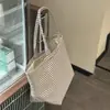 Bolsa de lona listrada estilo coreano de alto valor para mulheres 2025 nova de grande capacidade portátil para carregar na mão bolsa tote para o dia a dia bolsa de compras