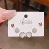 Verano nuevo chapado en oro real exquisitos tres pares de aretes pequeños de alto sentido pequeños frescos dulces aretes de temperamento combinables