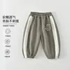 Suministro directo de fábrica de pantalones deportivos de dibujos animados de Clase A para niños y niñas, pantalones holgados de otoño, pantalones deportivos casuales suaves para niños pequeños