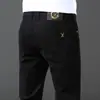 Jeans preto slim fit estilo Hong Kong para homens, moda coreana outono/inverno, forrado com fleece, elástico, calças compridas casuais versáteis