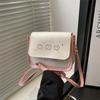 Bolsa feminina fofa 2025 nova bolsa estilosa de nicho moderna simples para deslocamento têxtil tudo combina bolsa de ombro transversal para meninas