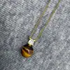 Zircón Francés Piedra Ojo de Tigre Collar Princesa Diana Pendientes de Mujer 2025 Nuevo Estilo Caliente Gama Alta, Suave, Pequeño y Exquisito