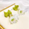 Corea del Sur nuevos pendientes de flor de lirio del valle moda femenina pendientes de lazo de perlas versátiles pendientes de campana dulce elegantes
