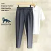 Diseño de nicho de alta gama, pantalones de hombre lisos y sin arrugas, pantalones de traje casual ajustados de color liso retro para verano, modernos