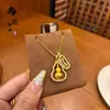 Tienda de oro con collar de oro antiguo mortero valiente colgante de diamante cruz cadena para clavícula femenina plegada venta al por mayor
