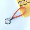 Chaveiro de corda trançada com anel duplo chaveiro de couro PU colorido novo pingente para bolsa feminina chaveiro para pendurar na cintura