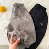 Pantalones largos para niños 2026 nuevo producto de verano, pantalones unisex de color liso con cordón y letras, pantalones curvos versátiles para niños pequeños