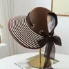 Sombrero de paja a rayas de verano transfronterizo, sombrero de ala ancha para mujer, sombrero de paja elegante para protección solar, sombrero de playa, sombrero tejido