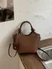 Bolso de cubo tejido a la moda y moderno, bolso cruzado de nicho único y elegante, bolso tote casual chic estilo coreano para el día a día