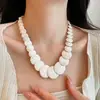 Colar de concha de alta qualidade feminino de verão, estilo de férias, corrente de clavícula de moda simples, nicho literário, joias Joker, atacado