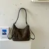 Bolsa retrô de grande capacidade estilo commuter para mulheres, nova bolsa de ombro casual e versátil 2026, bolsa transversal e mochila multiuso