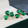 Pendientes de Trébol Esmeralda Cruzados Tang Jia para Mujer Pendiente Dorado de Lujo Ligero Pequeño Nicho Sensación de Alta Gama