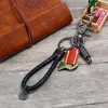 Chaveiro de couro trançado vintage direto da fábrica loja online criativa pequeno presente simples para carro chaveiro de couro de vaca