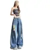 Jeans rasgados estilo retro americano talla grande para mujer, nuevo estilo principios de otoño 2026, diseño de calle moderno, pantalones de tiro bajo hasta el suelo