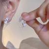 Clip para oreja de borla Super Hada Estrella para Mujer Aretes largos elegantes de lujo ligero ins nuevos nicho de celebridad de internet nuevos aretes combinan con todo