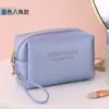 Nova bolsa de maquiagem em couro PU com padrão cruzado, bolsa de higiene pessoal à prova d'água, nécessaire multifuncional portátil para armazenamento de skincare