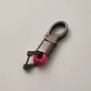 Directo de fábrica llavero de cuerda tejida accesorios de ferretería hebilla de herradura colgante para llave de coche accesorios de coche de moda