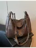 2026 Nova Bolsa de Ombro Única Retro de Grande Capacidade para o Dia a Dia Moda Versátil Casual Design de Nicho Bolsa Transversal com Corrente