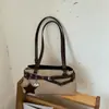 Bolsa de ombro estilosa estilo moto para mulheres, novo modelo 2026, bolsa de mão para o dia a dia, pequena bolsa tote para sair para o trabalho, bolsa baguette