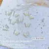 Accesorios metálicos para decoración de uñas de ojo de gato mariposa de circonita, decoración de uñas de aleación de rhinestone tridimensional súper brillante, colores oro y plata con goteo de aceite