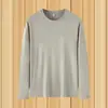 Camiseta de manga larga de color liso para hombre para primavera y otoño, estilo ins Hong Kong, corte holgado, negro puro, cuello redondo, talla grande, top de capa base