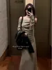 Conjunto de Otoño: un Conjunto Completo de Vestidos de Punto de Hombro Único de Gama Alta para Mujer en Otoño 2024 Nuevas Faldas Largas Ajustadas
