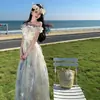 Estilo vacaciones de verano en la playa falda de tirantes de punto vestido de una pieza con volantes estilo francés