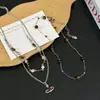 Dulce y Fresco Sexy Collar Apilado de Ojo de Tigre Saturnino de Doble Capa para Mujer Accesorios de Cadena para Suéter Retro de Nicho de Alta Gama
