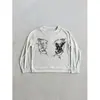 Camiseta de manga larga con cuello Henley redondo y botones, estilo Y2K milenio, subcultura, estampado retro, top básico, moderno