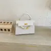 Bolsa quadrada pequena para mulheres, nova coleção 2026, bolsa de ombro de alta qualidade, bolsa de mão versátil, bolsa leve de luxo para o dia a dia, estilo bolsa Kelly