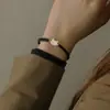 Pulseira de Corda Tecida Preta Versátil com Pingente de Concha de Gato 2024 Nova Moda para Namorada, Irmãs, Casal Joia de Mão
