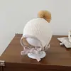 Gorro de lana con pompón de comercio exterior para niños, moderno y versátil gorro de punto de cordero de felpa, gorro pullover cálido para exteriores que protege los oídos para niños