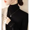 Suéter de capa base de cuello alto otoño e invierno nuevo estilo top de cuello de pelo jersey de manga larga tejido elegante ajuste ceñido tejido de punto blanco