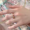 Nuevo Anillo Estilo Palacio Chino Esmalte Flor de Cuatro Hojas para Mujer Lujo Ligero Gama Alta Diseño de Nicho Anillo Ajustable