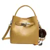 Elegante bolso pequeño retro para mujer, nuevo bolso cruzado versátil de moda 2026, bolso de mano popular de color liso, bolso tipo cubo