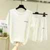 Camiseta de Seda de Gelo de Manga Curta para Mulheres Verão 2026 Novo Estilo Solta Casual Gola Redonda Conjunto Fino Slimming Visual Cor Lisa Conjunto de Duas Peças