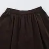 Ins estilo europeo y americano transfronterizo 2026 nueva moda elegante falda midi de color liso con cintura elástica y bolsillos para mujer de oficina retro