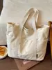 Bolso tote simple de gran capacidad, nuevo bolso tote casual de lona de color liso, estilo moderno, bolso de hombro para el trabajo, principios de otoño 2026
