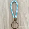 Llavero de cuerda de cuero trenzado simple creativo colgante de muñeca linda accesorios de llave para parejas tendencia regalos pequeños venta al por mayor