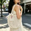 Bolso de hombro tejido casual para mujer, nuevo bolso de paja calado, bolso de mano casual estilo estudiante para playa