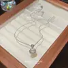 Colgante de Luz de Seguridad con Piedra Ojo de Gato de Hielo Lujo Nicho Versátil Cadena para Clavícula de Acero de Titanio Diseño para Mujeres Candado de Longevidad