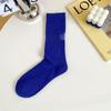 Calcetines para hombre otoño e invierno calcetines estampado en caliente letra raya color sólido calcetines de algodón desodorantes calcetines altos al por mayor