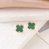 Conjunto de tres piezas de moda de acero de titanio con trébol de cuatro hojas (pulsera, collar y pendientes), venta caliente transfronteriza, joyería de flor de trébol de la suerte al por mayor