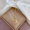 [Acero de titanio] Lujo ligero pájaro volador pájaro carpintero microincrustado oro real collar femenino suerte ins celebridad de Internet cadena de clavícula accesorios