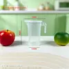 Taza medidora de plástico de fábrica con escala, adecuada para tiendas de té de burbujas y repostería, hecha de material de PC engrosado con tapa, disponible en varios tamaños, resistente a altas temperaturas, taza transparente