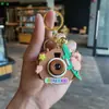 Tarjeta de dibujos animados Pibala proyección llavero aleatorio regalos para estudiantes juguetes para niños puesto máquina de garra regalos pequeños venta al por mayor