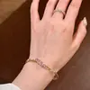 Pulsera transfronteriza nueva de imitación de oro para mujer, estilo de lujo ligero, incrustada con circonio de color, pulsera de estrella, joyería de nicho de alta gama al por mayor